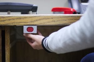 A panice button under a desk for help